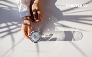 Person holding a cup of water.